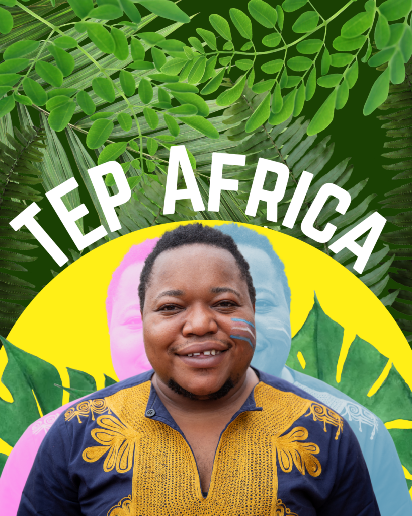 Image depicts a non-binary Black person smiling while standing in front of a yellow and green fauna. The person is seen smiling with Trans pride colored stripes (pink, blue, and white) painted on their face. This image was created to promote the community space for TEP Africa. 