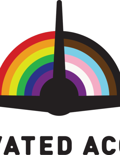 Elevated Access's logo shows the silhouette of a plane in front of a circular version of the progressive pride flag on the horizon